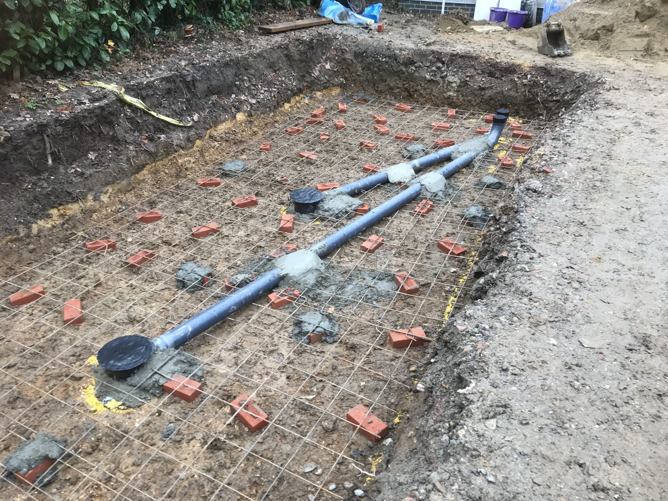 Raised pond with viewing window - construction
